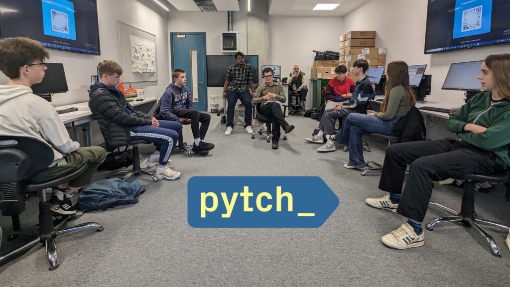 The image shows seven students in a computer lab during a focus group. In the center of the room is visible Dr Ben North leading the focus group with support from Brian Gillespie with his team member. The Pytch logo is visible at the bottom of the image.